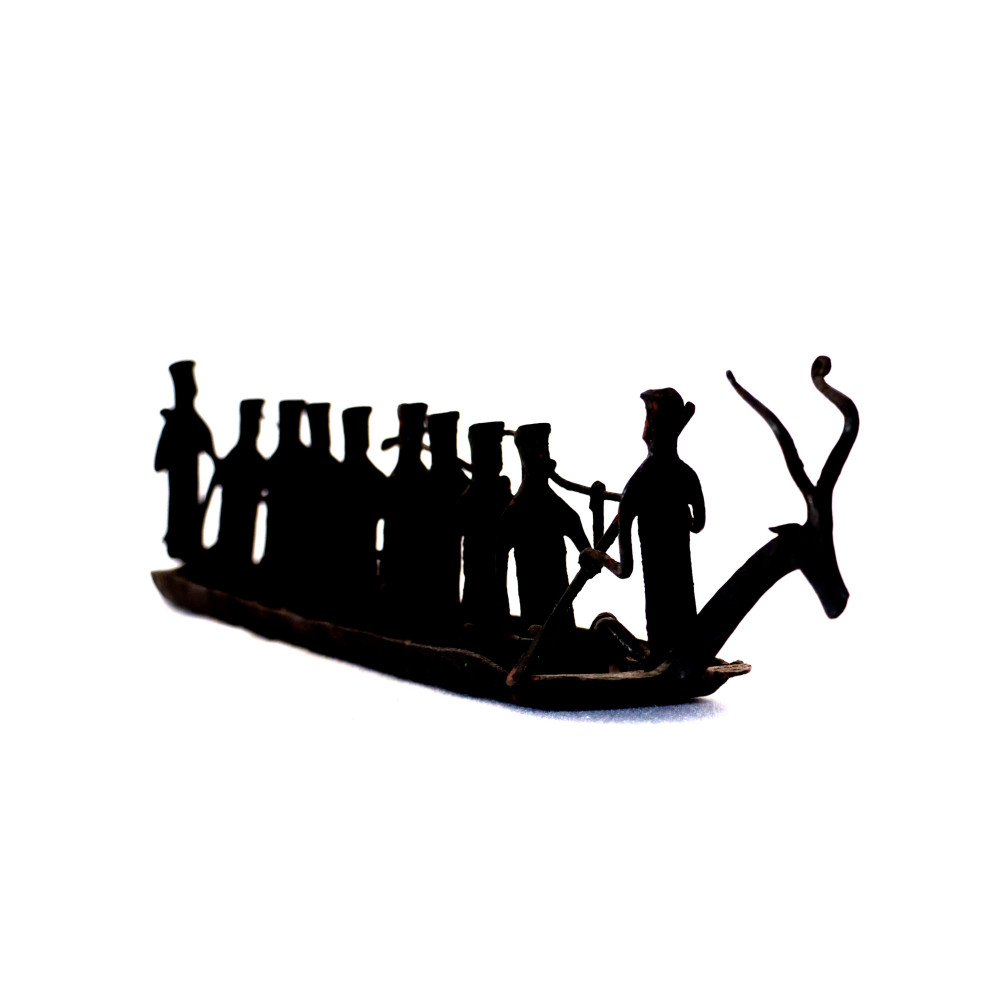 Tribal group with boat figurine